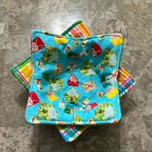 Handmade reversible 2 pack 100% cotton bowl cozies with envelope print.